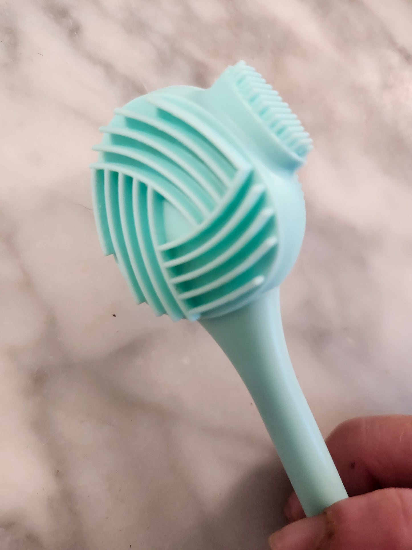 Eye Comfort Care Precision 4-in-1 Eyelid Brush in hand — gentle eyelid cleansing tool for dry eye home care routine
