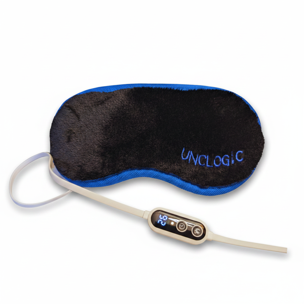 UNclogic Gen 2 Heated Eye Mask — black velvety plush with royal blue trim and inline controller, Far-Infrared dry eye heat therapy mask on white background
